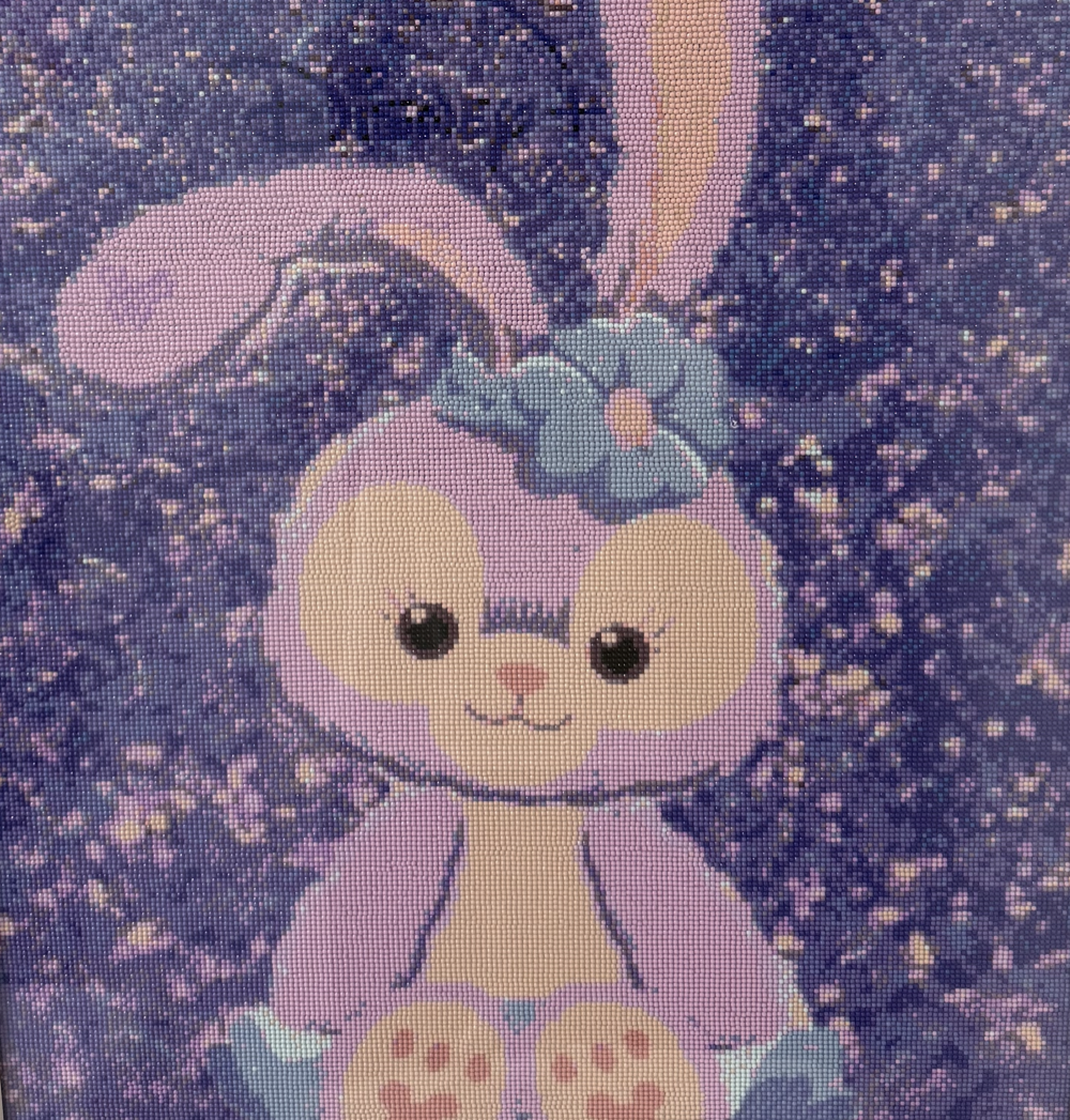 Purple bunny diamond painting on a starry background