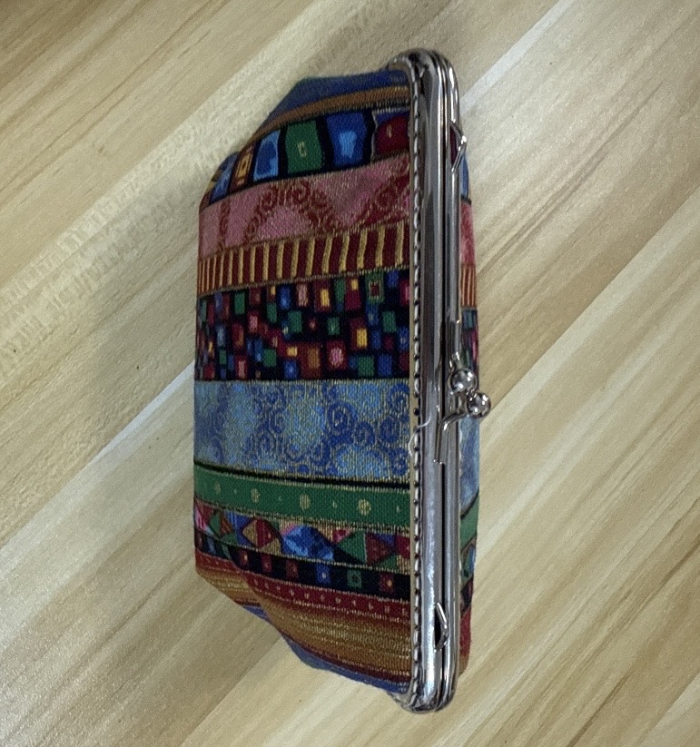 Color striped frame clutch purse